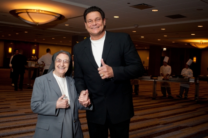 Chicago Bears star Dan Hampton poses with nun half his size at the Presence Ball, event photography by fab photo