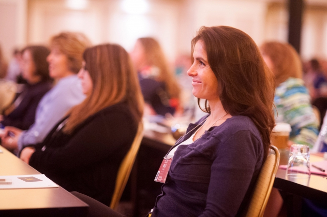 audience member reacts to keynote speech by aig ceo ben moshe