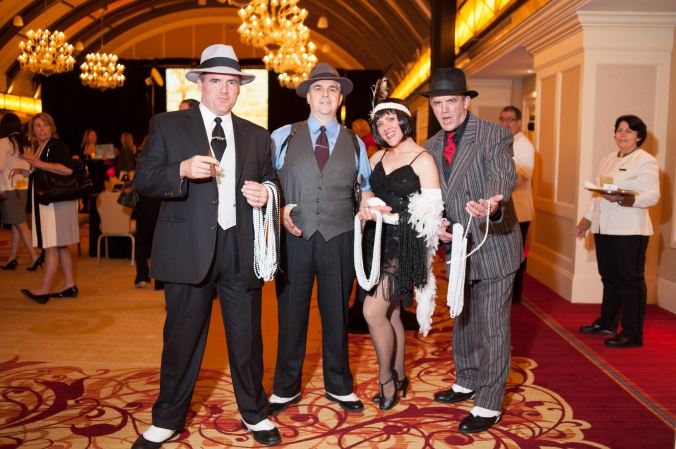 actors play 20s gangsters and flapper girls for corporate event speakeasy themed cocktail hour
