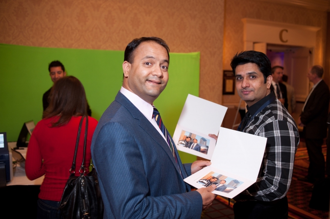 conference attendees show off green screen photo souvenirs, amia annual symposium chicago