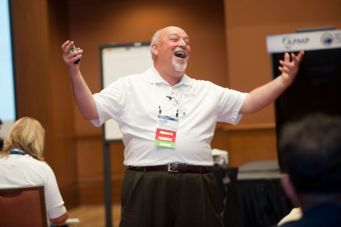 photo of enthusiastic speaker at conference breakout sesssion.