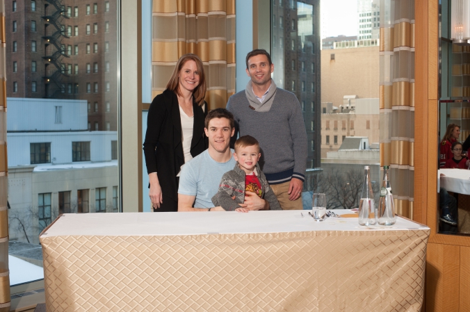 sports celebrity photo of family meet and greet with chicago blackhawks andrew shaw.