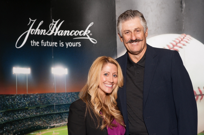 Hall of Fame pitcher Rollie Fingers poses with a lovely fan at the  John Hancock photobooth activity at the morning star investment conference.