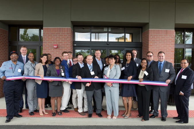 Ribbon cutting ceremony photo from opening of Freedom's Path, Veteran's assisted living facility.