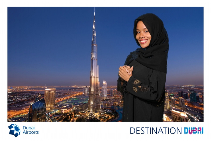 woman poses with dubai tallest building in the world, burj khalifa, dubai, made possible with green screen tradeshow photography, fab photo chicago