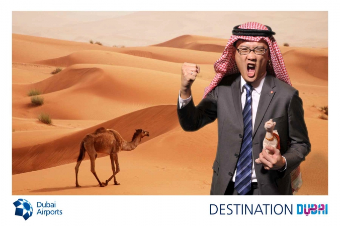 screaming asian man holds camel doll in desert, photo postcard, dubai airports, world routes mccormick place chicago 2014,