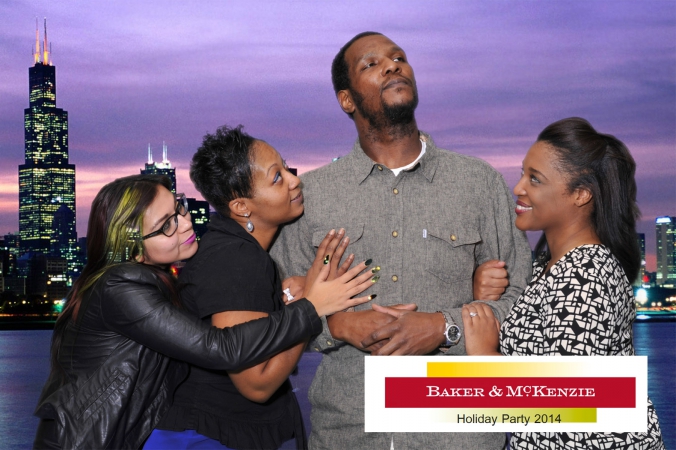 ladies man poses heroically on chicago skyline background, green screen photography by fab photo chicago at baker mckenzie holiday party