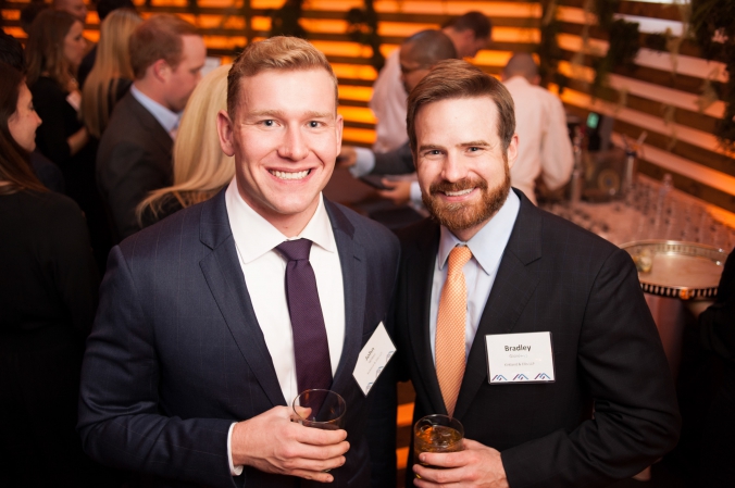 Lawyers pose for a candid portrait at kirkland ellis private celebrity chef event garden of earthly delights.