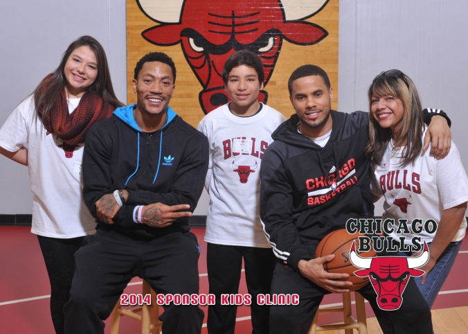 chicago bulls rewards sponsors with logo branded photos of kids with derek rose