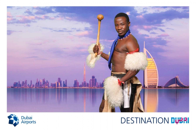swasiland warrior with burj al arab green screen photo becomes logo branded postcard, world routes annual conference