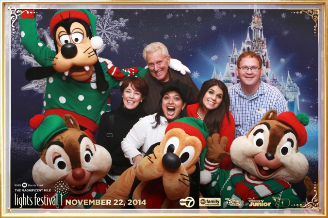 disney characters goofy pluto chip and dale pose with guests at chicago abc7 corporate event festvial of lights