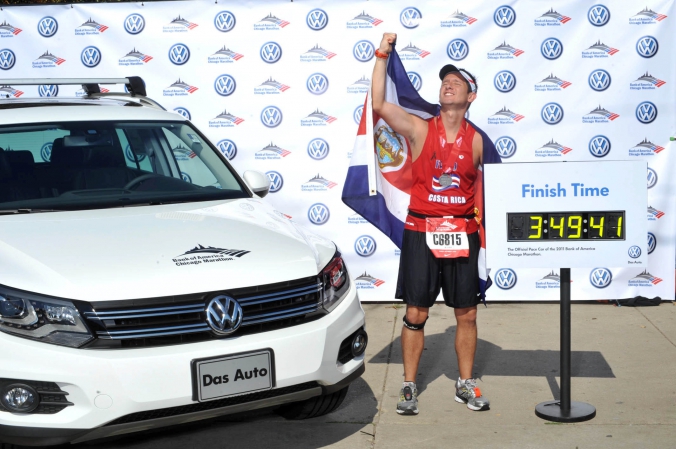 costa rican runner celebrates end of chicago marathon with onsite photo prints sponsored by vw and bank of america