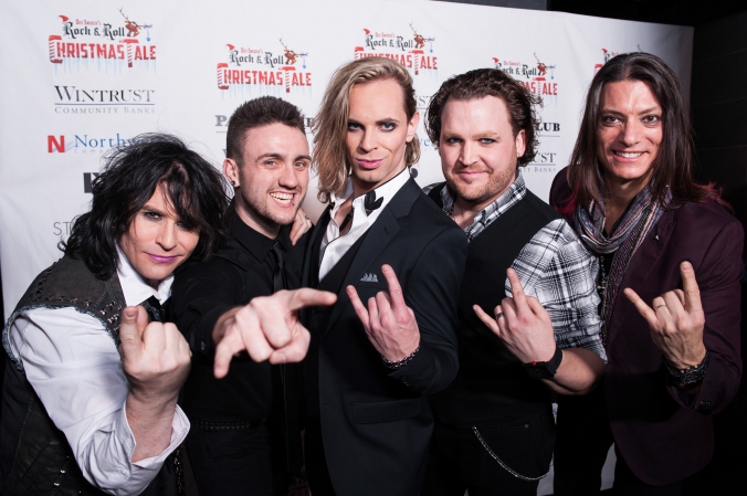 Cast of Dee Snider's Rock & Roll Christmas Tale pose on step repeat, after party at Studio Paris, photo by FAB PHOTO