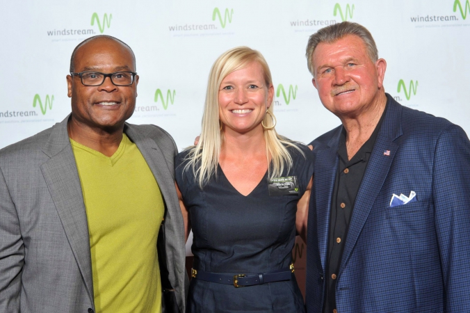 windstream corporation recruits chicago football legends mike singletary and coach ditka to pose with guests on step repeat photography at their event